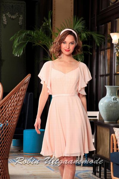 Chiffon cocktail dress with pleated sleeves and skirt above the knee